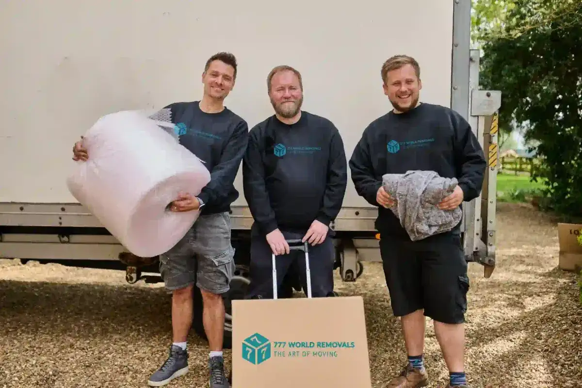 777 World Removals crew packing boxes for a move