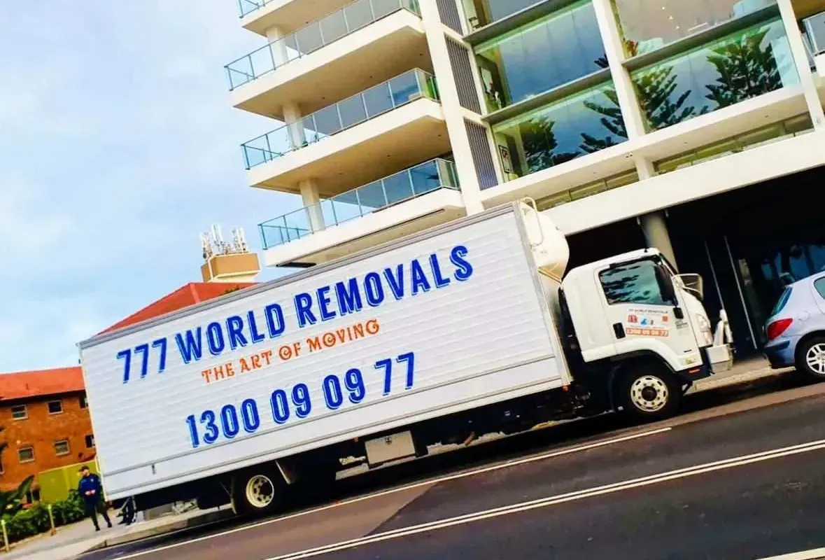 A 777 World Removals truck at a Wollongong apartment block before an interstate move